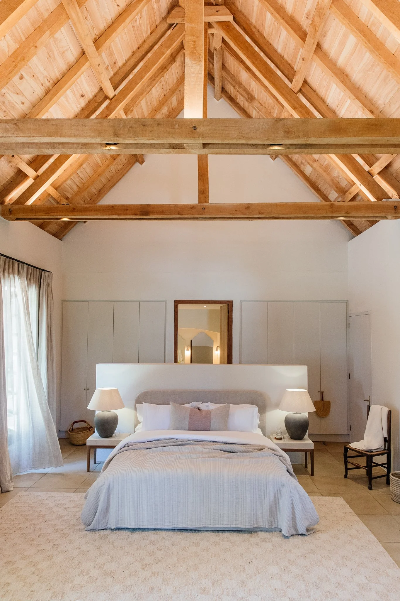 A guest bedroom under the thatched beams at Nieuwe Sion
