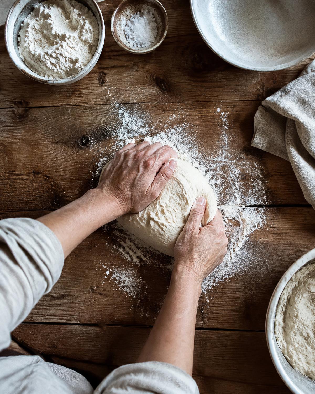 Hands kneading bread dough